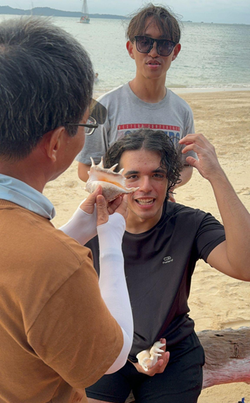 Prof Wu combing Kiran’s hair with a seashell

